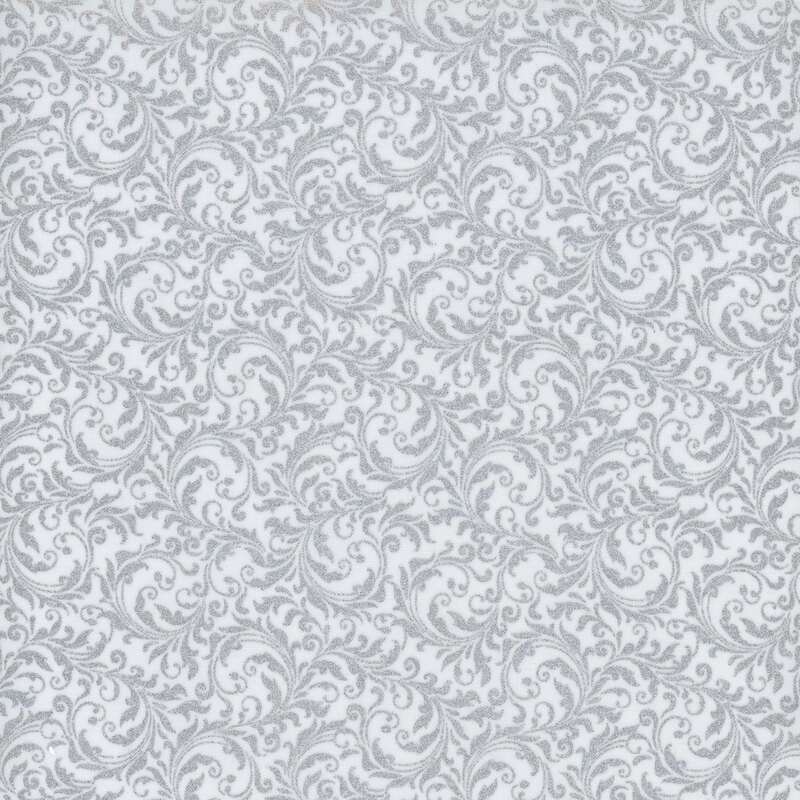 White fabric with an intricate filigree pattern and metallic silver accents.