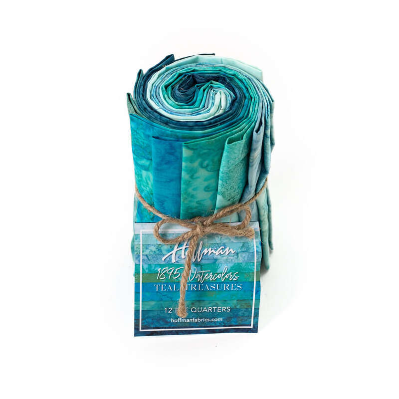 Rolled fabric bundle labeled Teal Treasures, featuring 12 fat quarters in aqua and teal tones.