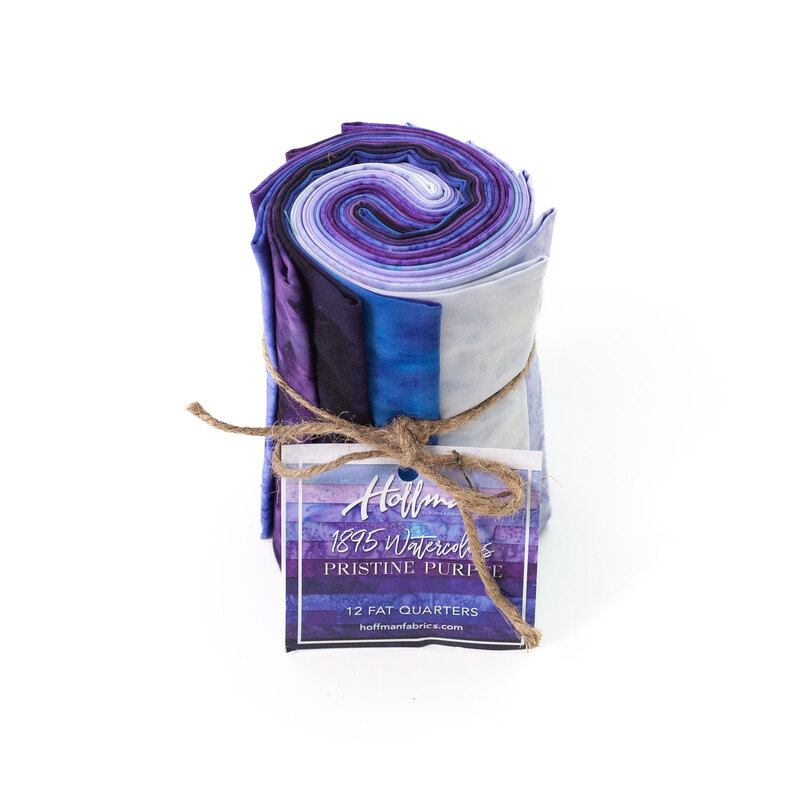 Rolled fabric bundle labeled Pristine Purple, featuring 12 fat quarters in purple tones.