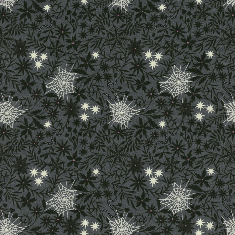 A gray patterned fabric featuring white spiderwebs and various flowers and leaves.