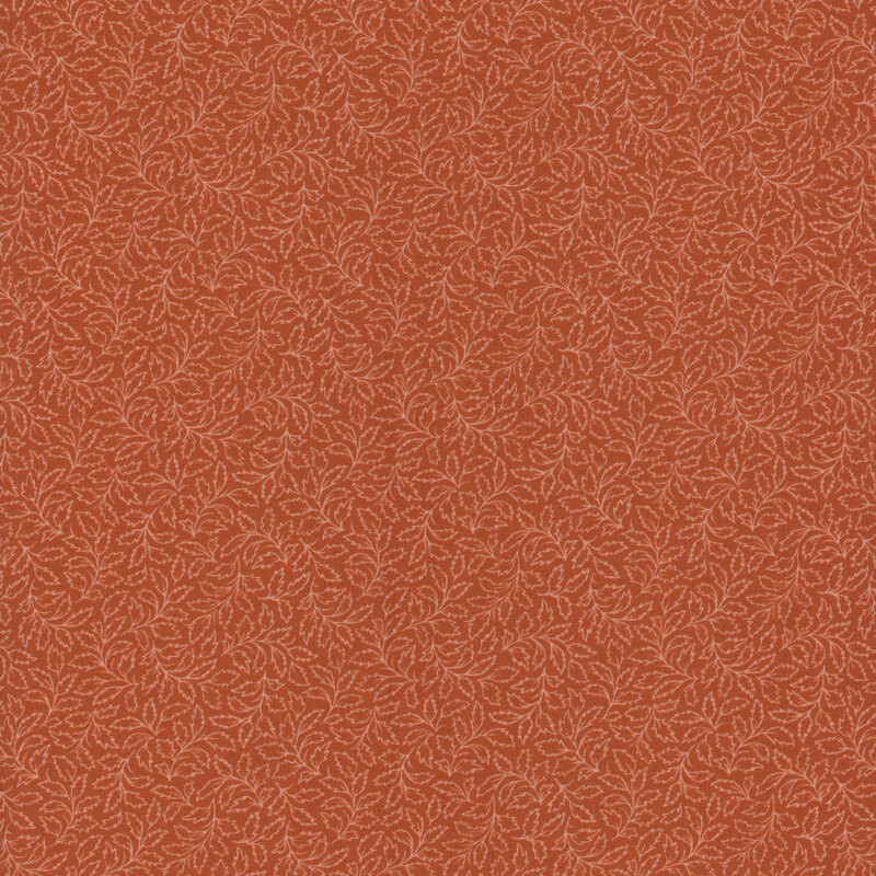 A repetitive floral pattern in a warm, rust-colored background with light detailing.