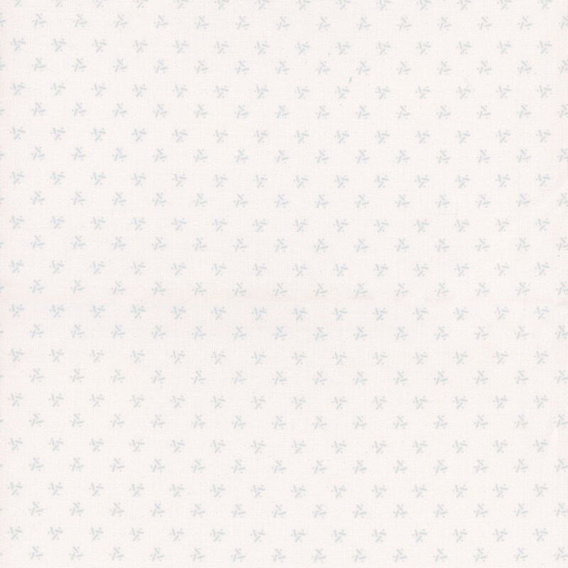 Lightly patterned fabric with small, pale green star shapes on a white background.