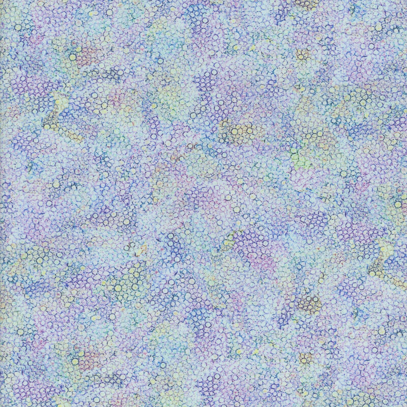 Abstract pattern of overlapping pastel-colored circles on a textured background.