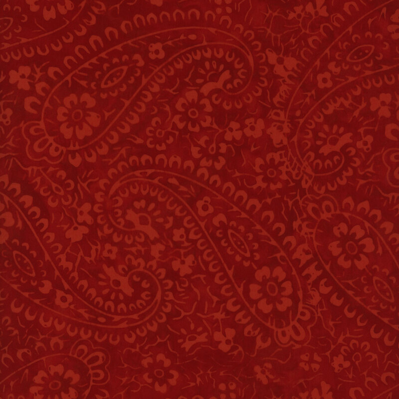 Red paisley pattern with floral motifs on a textured background.