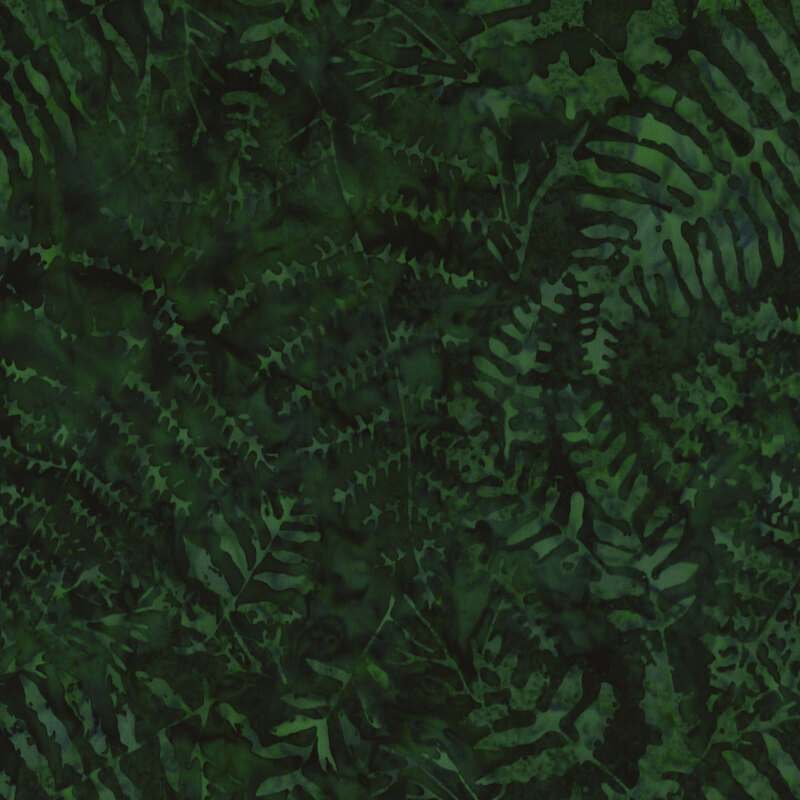 Dense pattern of various green ferns on a dark green background.