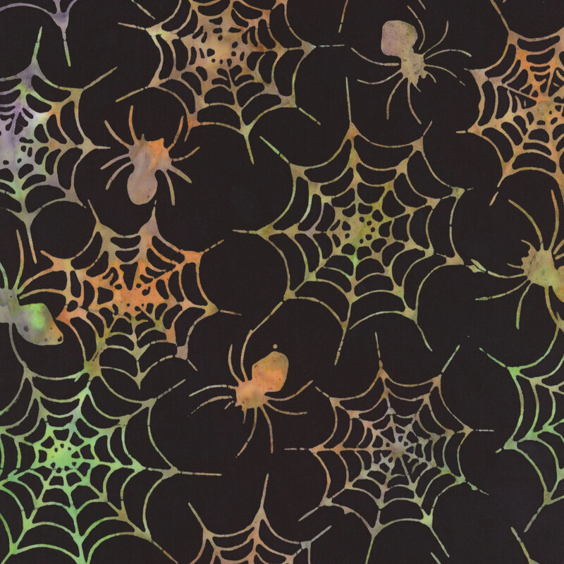 Black fabric featuring colorful spider web patterns with small, stylized spiders.