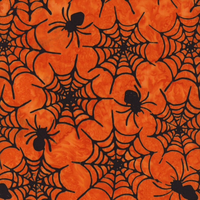 Pattern of black spider webs and spiders on an orange background, creating a Halloween theme.