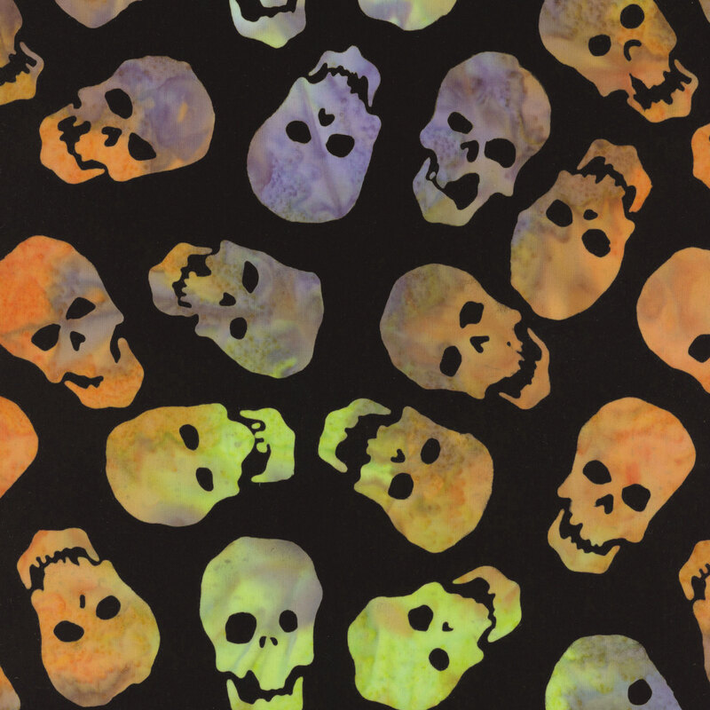 A repeating pattern of colorful skulls on a black background.