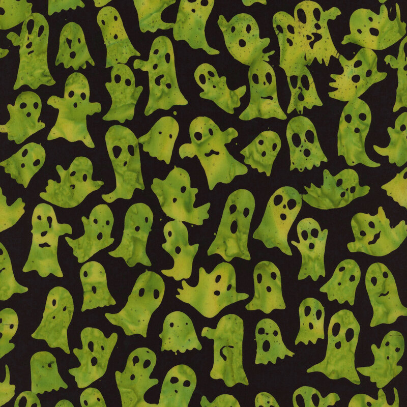 A pattern of green, whimsical ghosts on a black background.