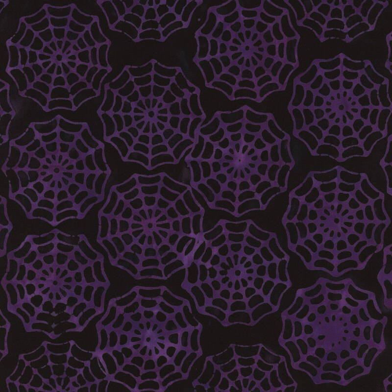 Purple spider web pattern on a black background, creating a spooky, festive design.