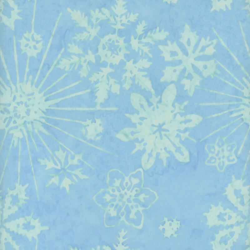 Light blue background with various white snowflake patterns scattered throughout.