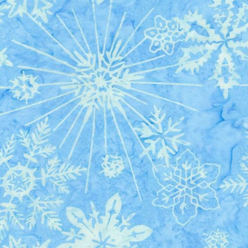 Light blue background with various white snowflake patterns scattered throughout.