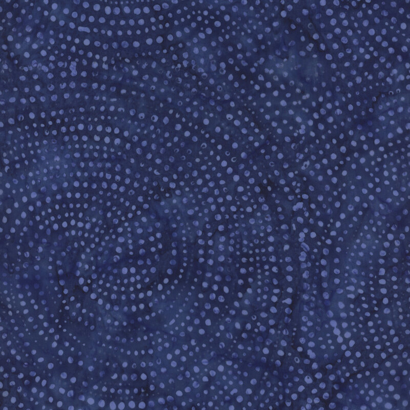 Deep indigo fabric with light blue dots in spiraled patterns