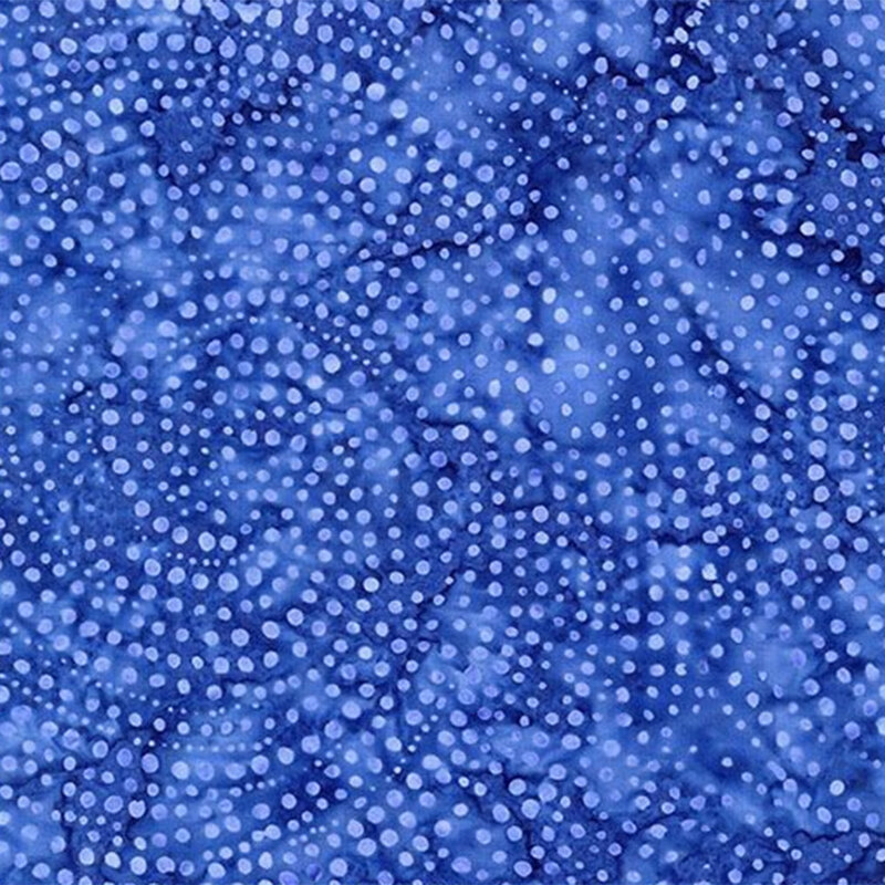 Deep indigo fabric with light blue dots in spiraled patterns