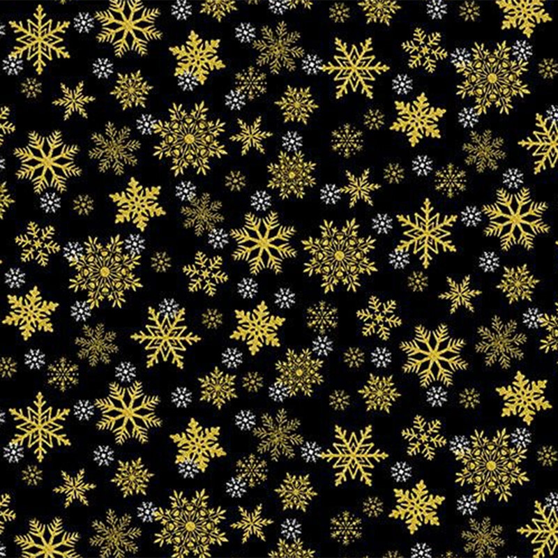 Pattern of yellow and white snowflakes on a black fabric.