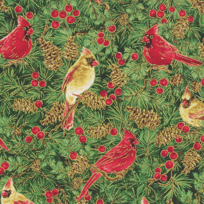 Green fabric featuring pine needles, pinecones, and red and gold cardinals with gold metallic accents.