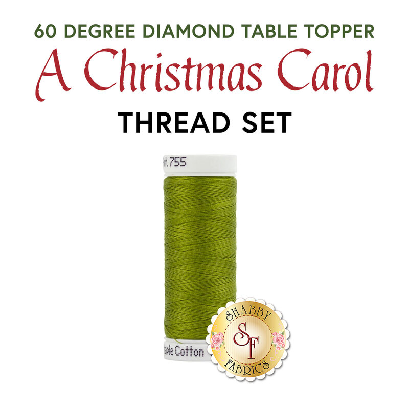 A single spool of Christmas green thread, isolated on a white background below a text graphic that reads 