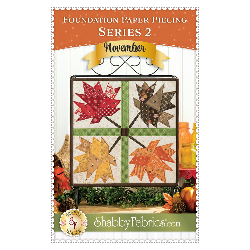 An image of the front cover of the Foundation Paper Piecing Series 2 November Pattern featuring the finished project with coordinating background decor.