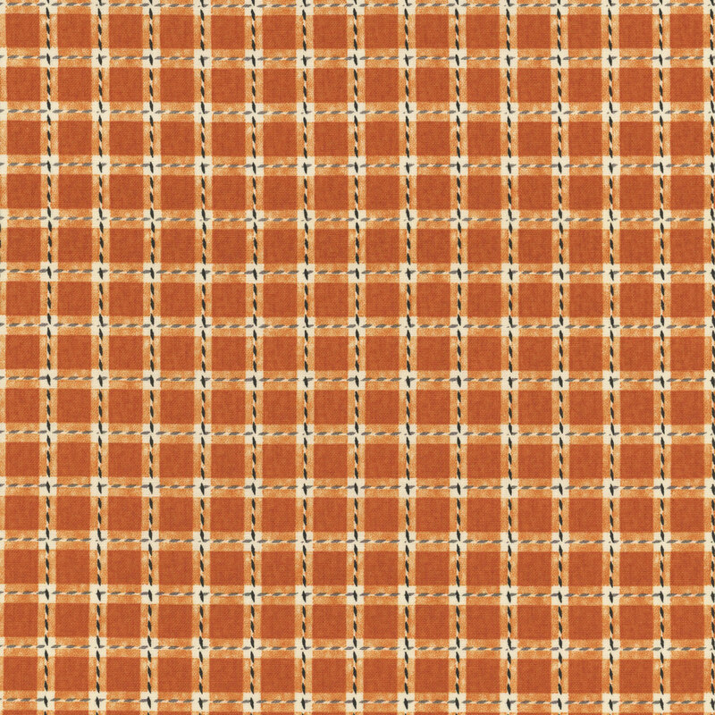 Orange, cream, and black plaid fabric