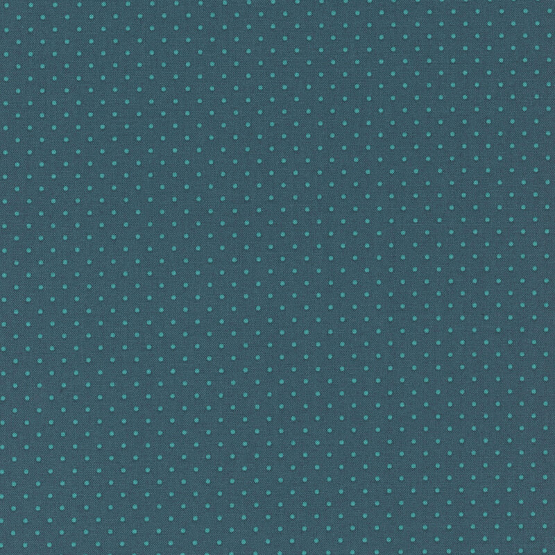 Blue fabric with a regular pattern of small teal dots evenly spaced throughout.