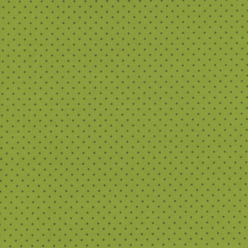 Green background with evenly spaced dark polka dots.