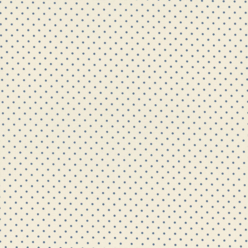 Cream-colored fabric with a pattern of evenly spaced, small blue dots.