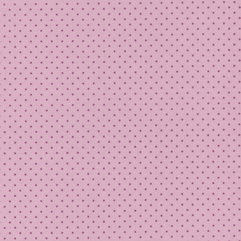 Purple fabric with evenly spaced darker purple polka dots.