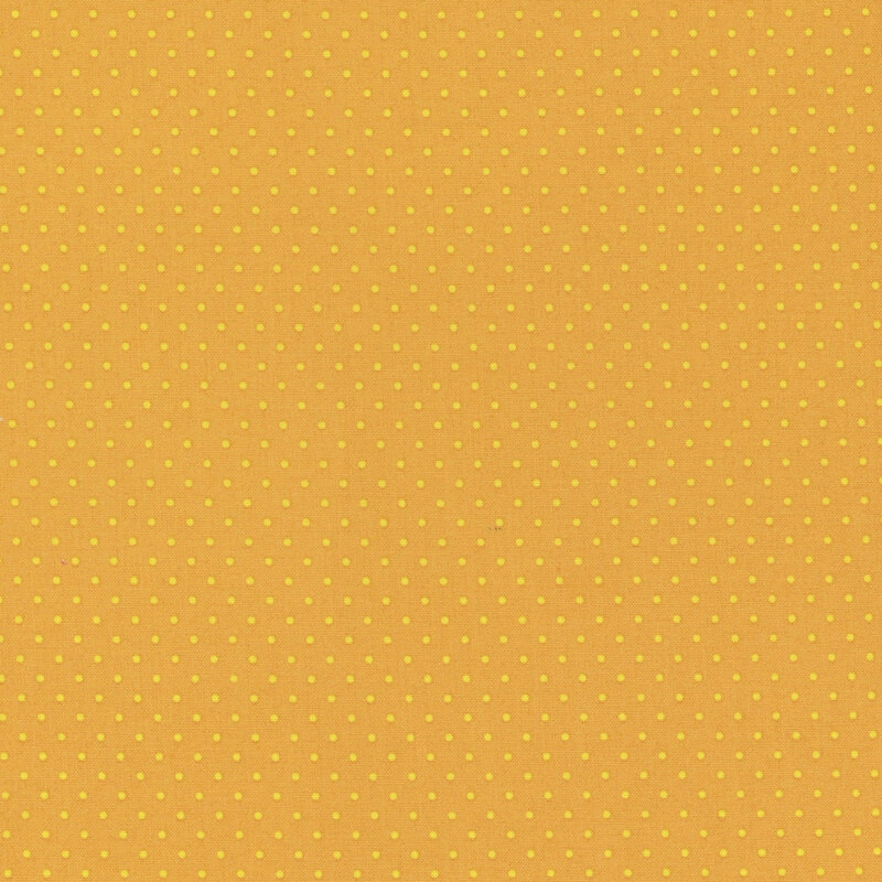 Yellow fabric with small, evenly spaced white polka dots.