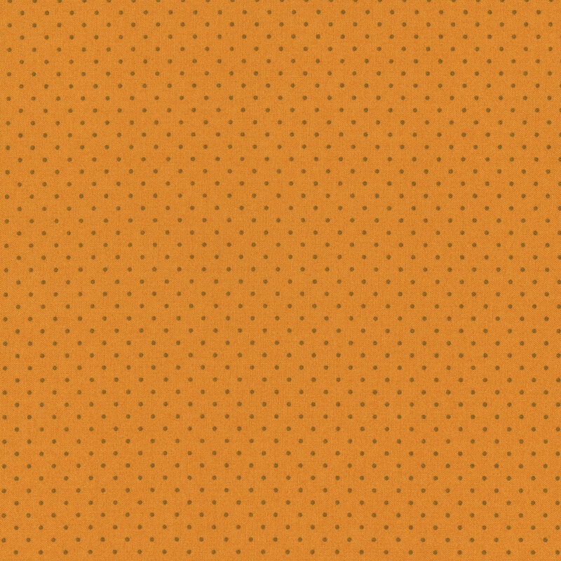 An orange fabric with evenly spaced small brown dots.