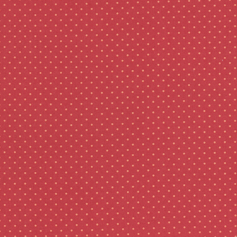 Red fabric with evenly spaced small orange polka dots.