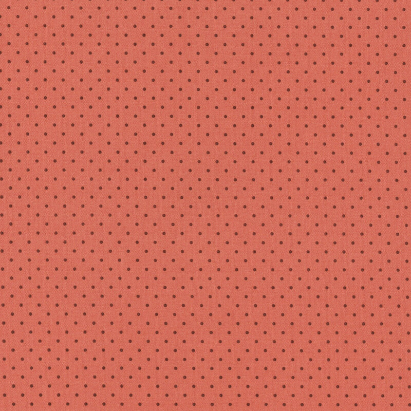 Solid coral background with a regular pattern of small black dots.