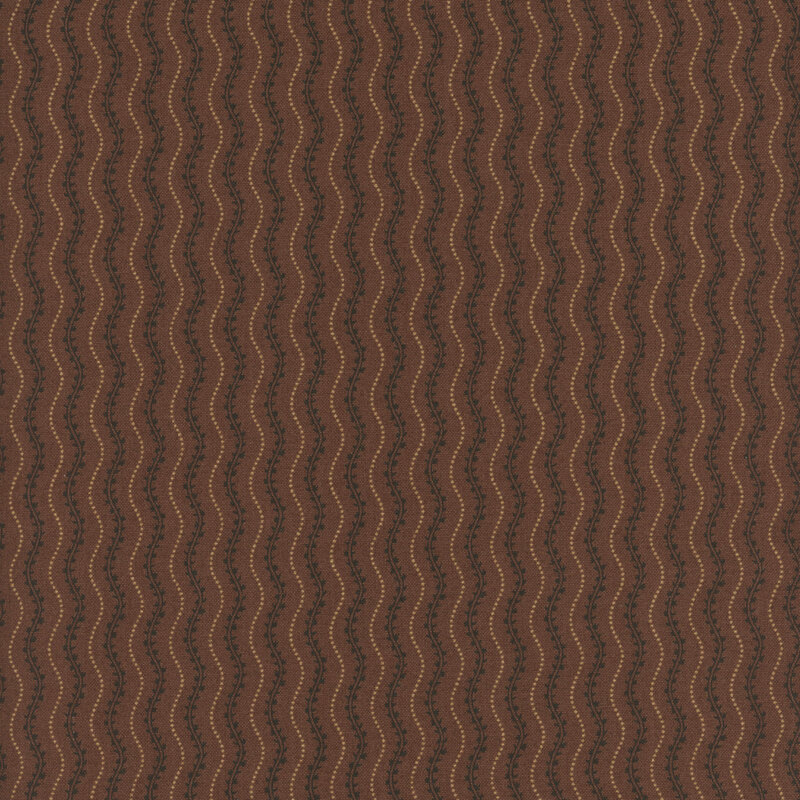 Wavy brown patterned fabric with black leaf motifs in a repeating design.