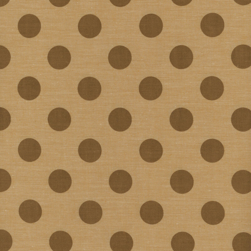 Yellow-brown fabric with brown polka dots.