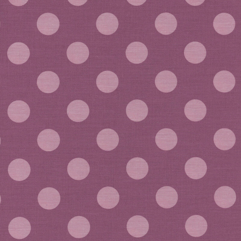 Warm purple fabric with lilac purple polka dots.