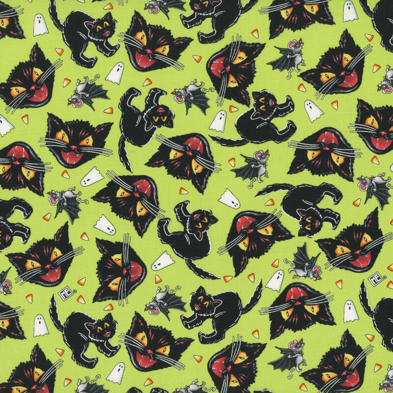 Lime green fabric with tossed hissing cats, ghosts, candy corn, and mice dressed up as bats.
