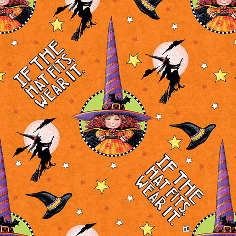 Orange fabric with flying witches, hats, scattered stars, and the phrase 