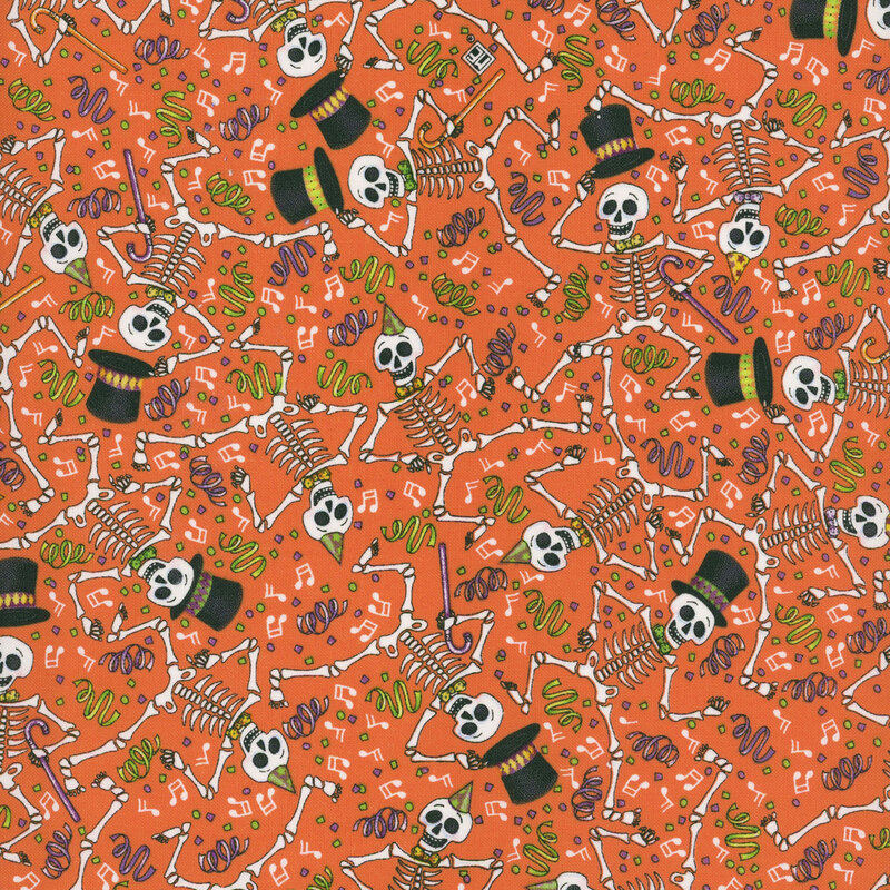 Orange fabric with a packed design of dancing skeletons and colorful confetti and music notes scattered across the background.