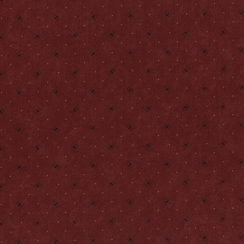 A deep burgundy fabric with a subtle pattern of small black dots.