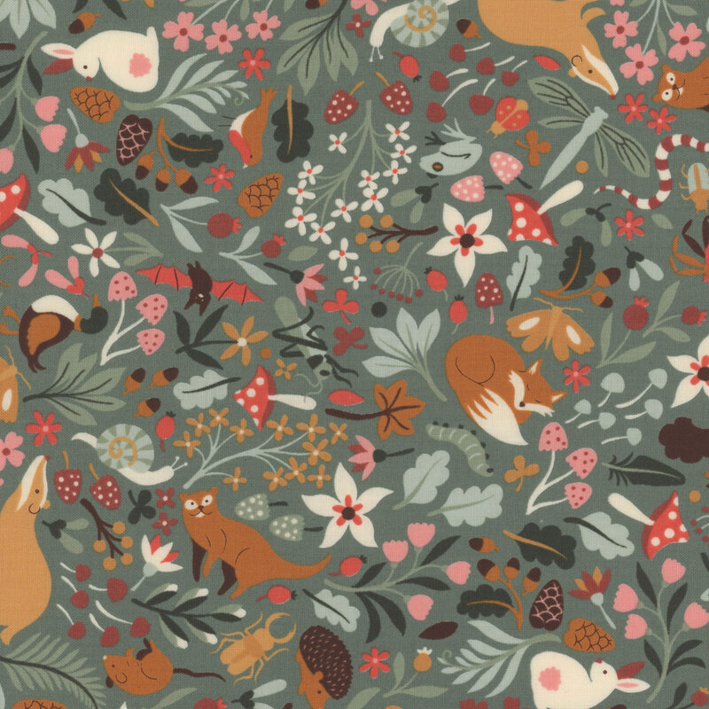 Eucalyptus green fabric with scattered forest animals and springtime flowers and leaves.