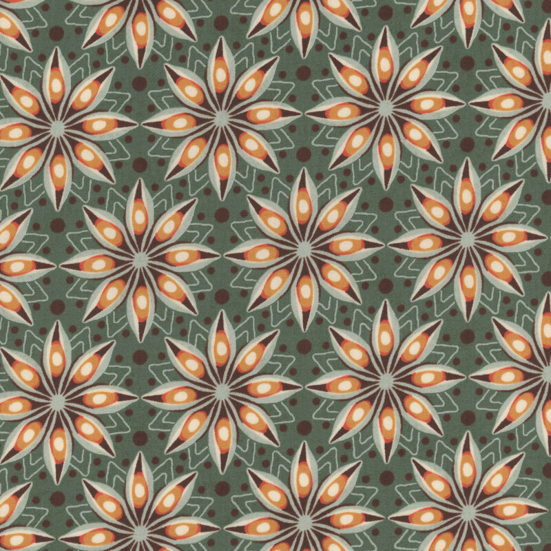 Eucalyptus green fabric with star-shaped flowers in shades of brown and orange on a dotted background.