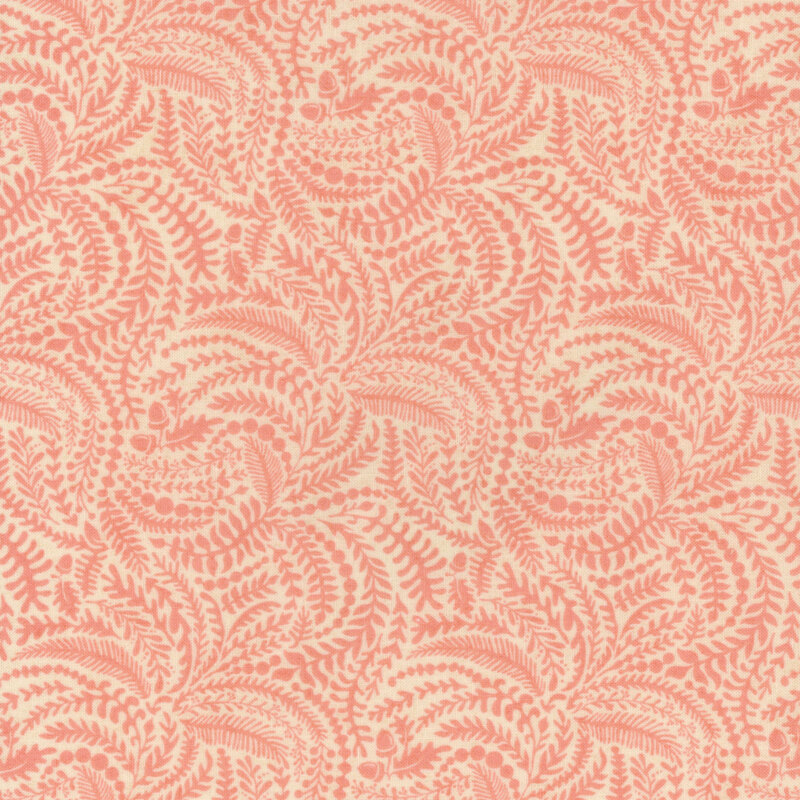 Pink fabric with a packed pattern of delicate ferns in on a cream background.