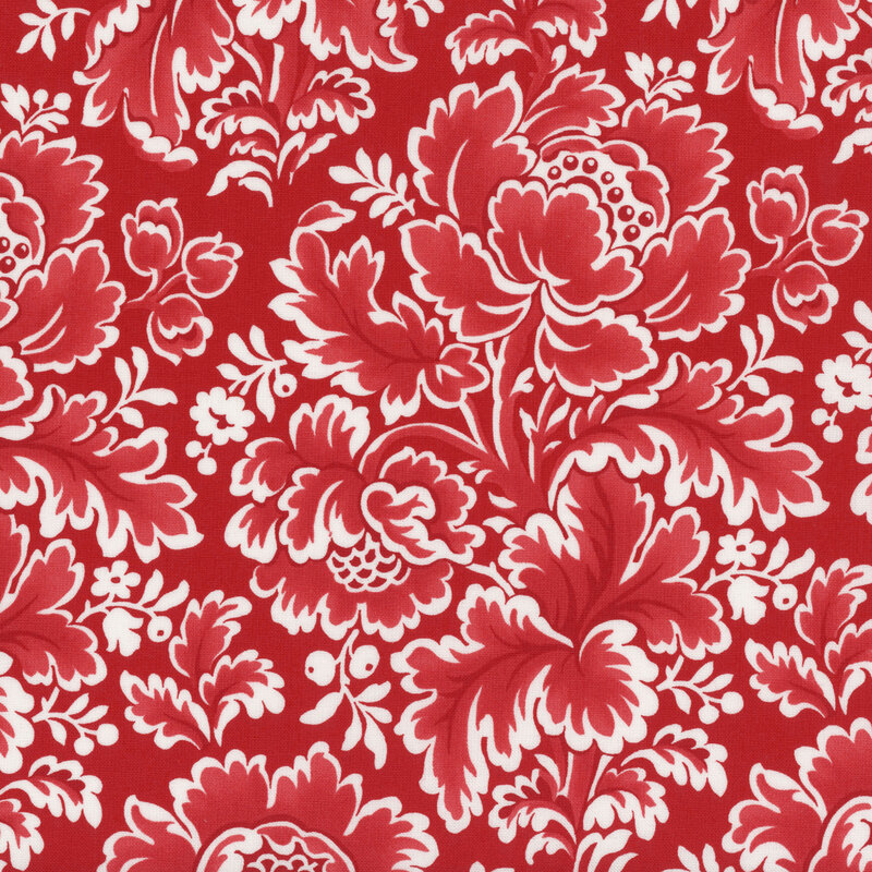 Deep red fabric with a vintage pattern of large white and red vintage florals.