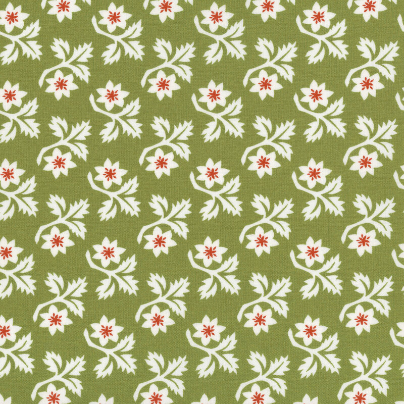 Green fabric with rows of white angular leaves and flowers with red centers.