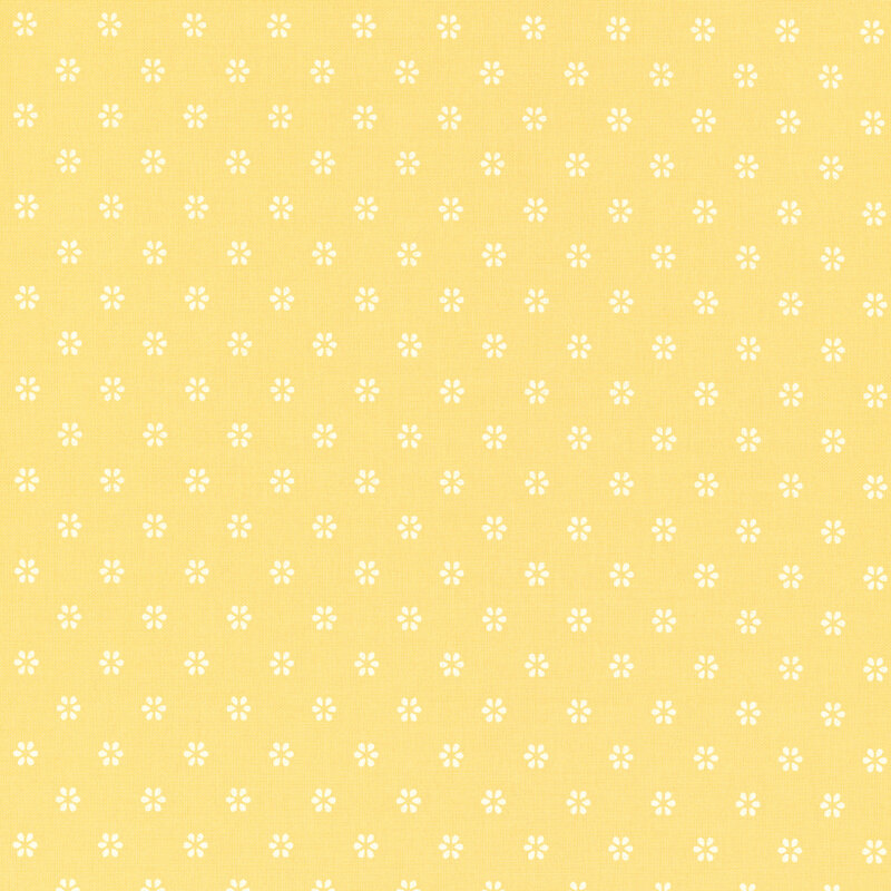 Yellow fabric with a repeating pattern of small, subtle flower shapes.