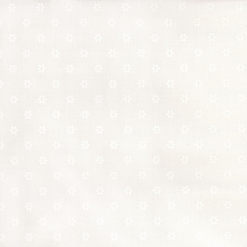 white on white fabric with a repeating pattern of small, subtle flower shapes.