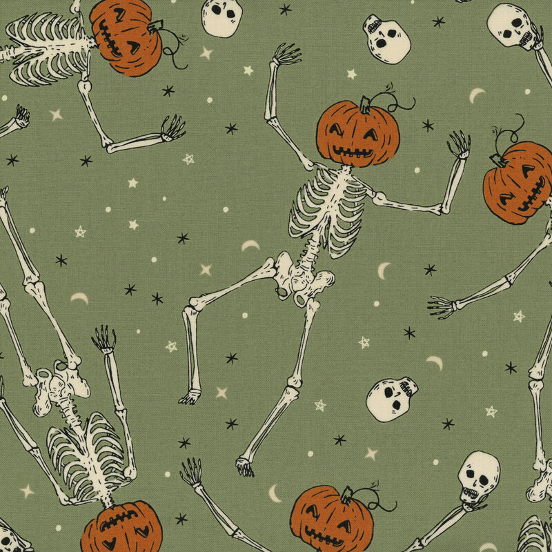 Mossy green fabric featuring dancing skeletons with jack-o-lantern heads and tossed skulls and stars in the background.