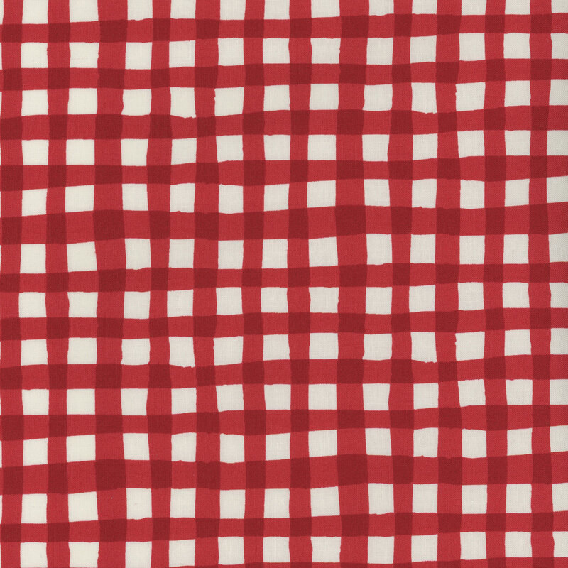 Red and white checkered fabric with alternating squares, creating a classic gingham design.