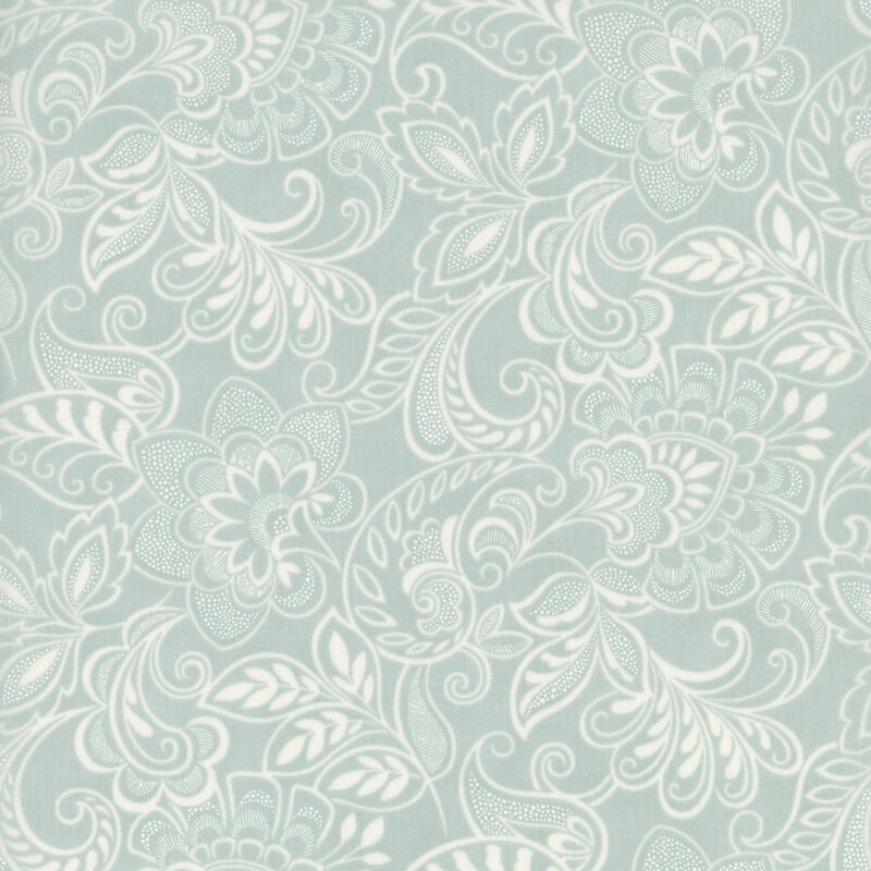 Light blue fabric featuring intricate floral and leaf patterns in a subtle design.