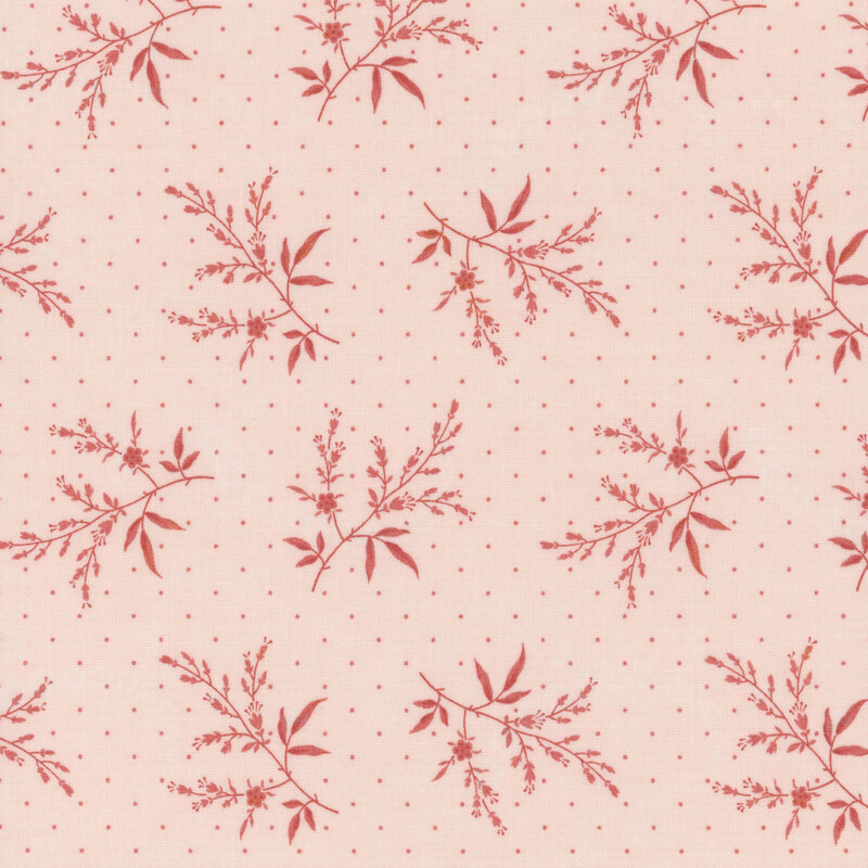 Fabric floral pattern featuring small pink branches on a light pink background with dots.