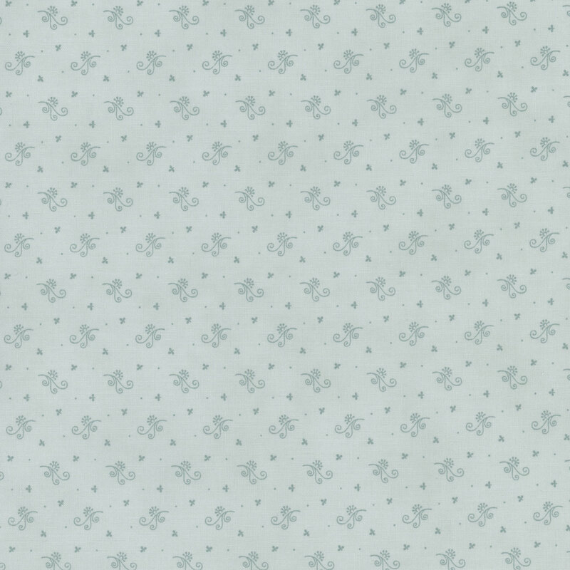 Light blue fabric with a subtle pattern of small flowers and dots.